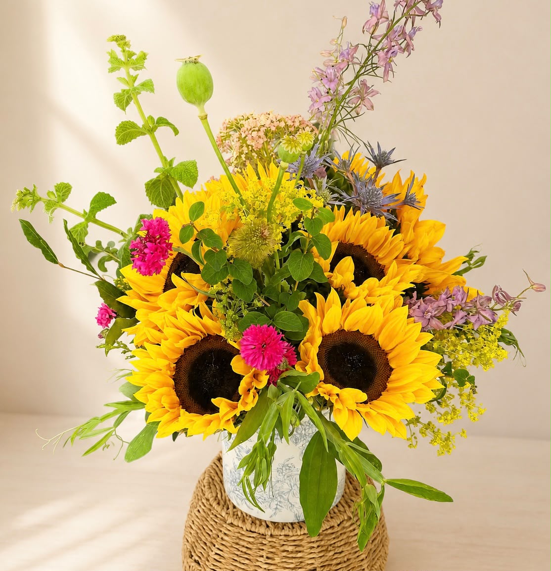 Hand-tied hat box of flowers by Willow and Moss