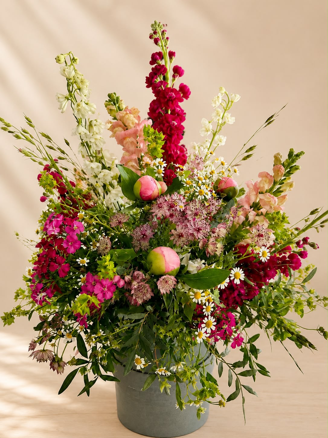 Hand-tied hat box of flowers by Willow and Moss