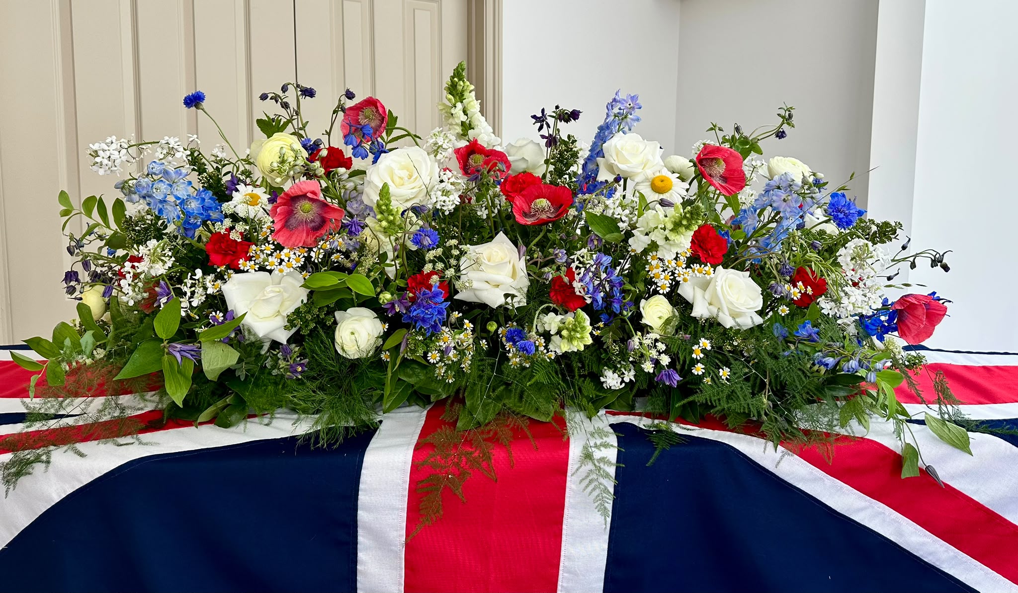 Casket flowers by Willow and Moss
